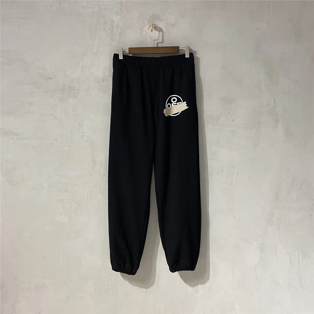 The top tested version for spring and autumn OFF WHITE OW patch bronzing tape arrow sweatpants, the same style pure cotton loose trousers for men and women couples, OW men's and women's loose leg-fitting sports casual pants, with anti-counterfeiting technology on the back, the real over-the-top version, OW yellow glue, obvious signature, unique high street style! The stylized design is printed on a classic frame, and a layer of foundation-colored colloid with a graffiti effect is superimposed on the printing. It is visually very consistent with the theme, as if a layer of tape has been pasted, and the design is brilliant! Heavy, tougher and retro, the main elements are heavily engineered, the micro-profile version is suitable for both men and women, surrounded by more street-style inkjet elements, and the inkjet style of street graffiti is everywhere. The printing is done on a Japanese-owned Mimaki printing machine, with no edges or burrs. Inkjet heat transfer is hot-pressed and cold-teared, and the high temperature is 180 degrees. The front piece needs to be pressed twice (the second time requires 180kg of air pressure). The transparent fabric pattern is anti-scratch and ironing, and the printing does not fog up. The semi-transparent tape in the front circle can reveal the covered part of the printing below. The color of the golden printing on the tape is not a flat color, and the colors of the tape printing are different in depth. The wash label is also customized according to the original font from the company. The accessories still use the full line of correct accessories. The rectangular woven collar label design has canceled the previous three-dimensional silicone feel font and changed it to a fully woven collar label. You can see fluorescent fonts on the collar label. The five-link silicone hang tag, the three-link washable label and the zebra crossing packaging line are still the same. Size chart Hips 56, recommended 120-150 catties M pants length 104 waist 80 hips 58 recommended 150-170 catties L pants length 106 waist 82 hips 60 recommended 170-190 catties (the waist is elastic and can be enlarged) Color: Black White P: 360